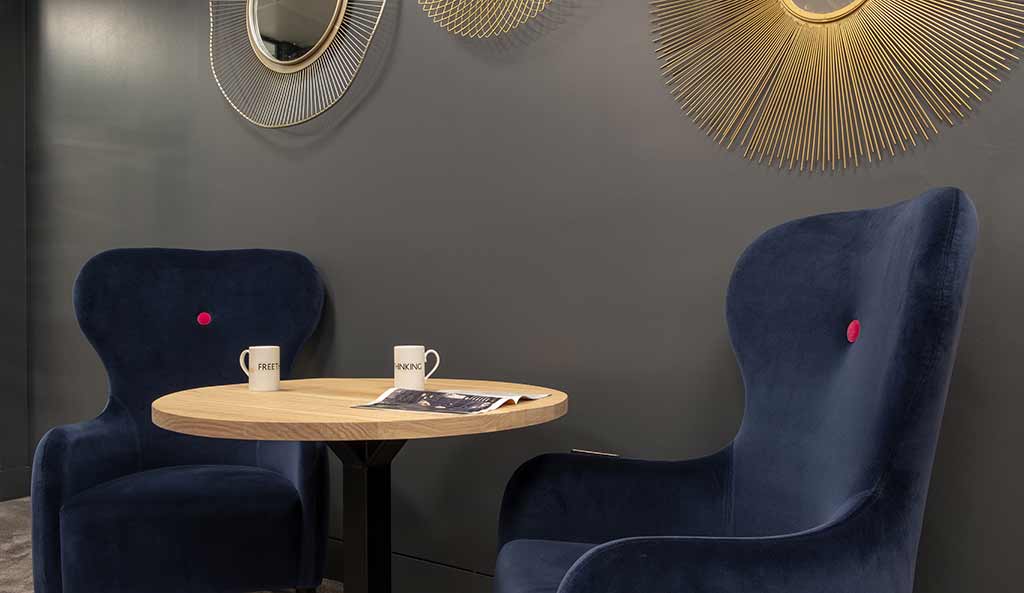 Luxury armchairs around coffee table
