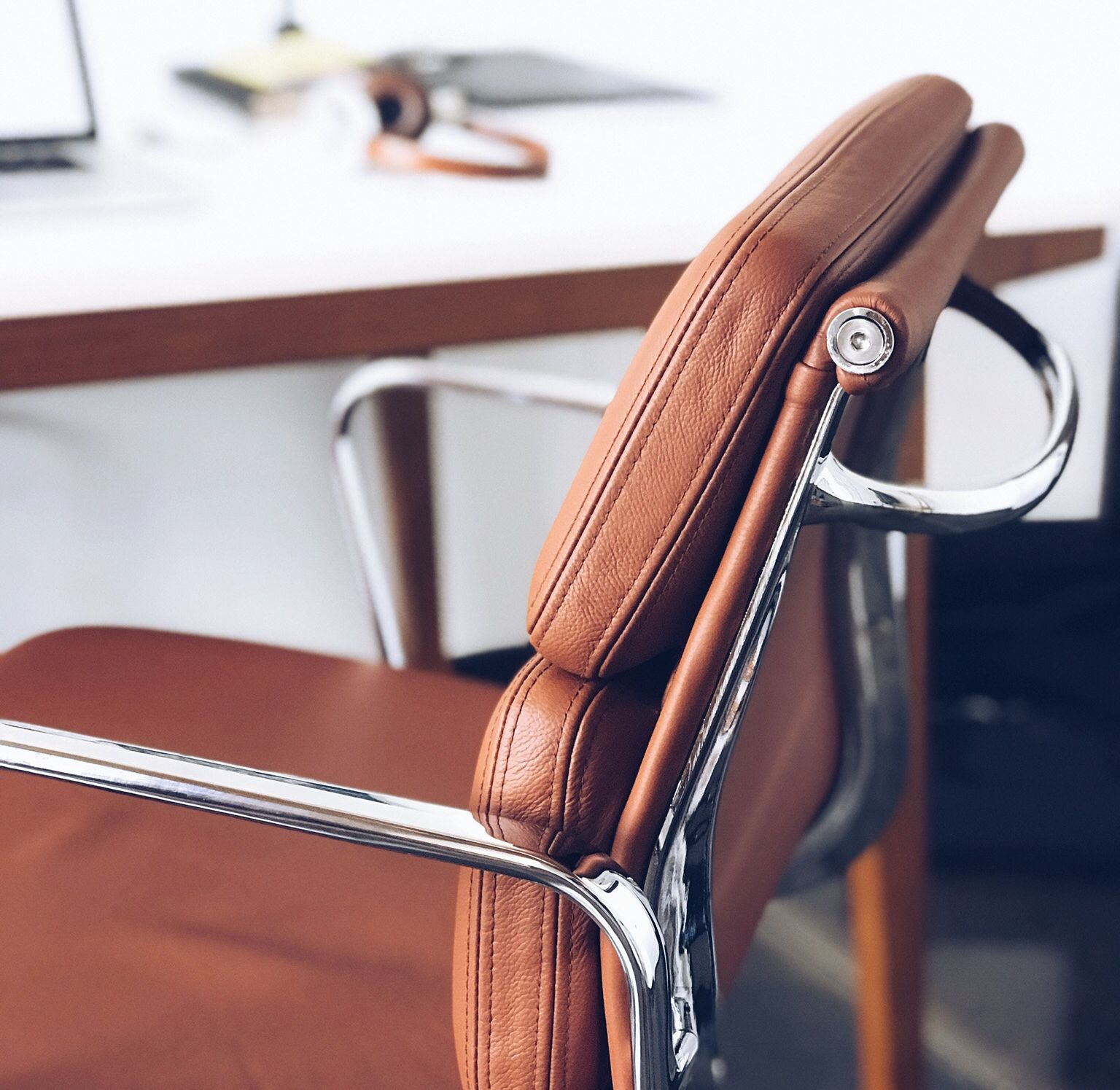 Brown leather and comfy office chair with silver chrome handles