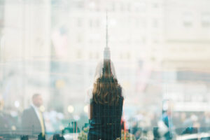 large office tower in reflection of window