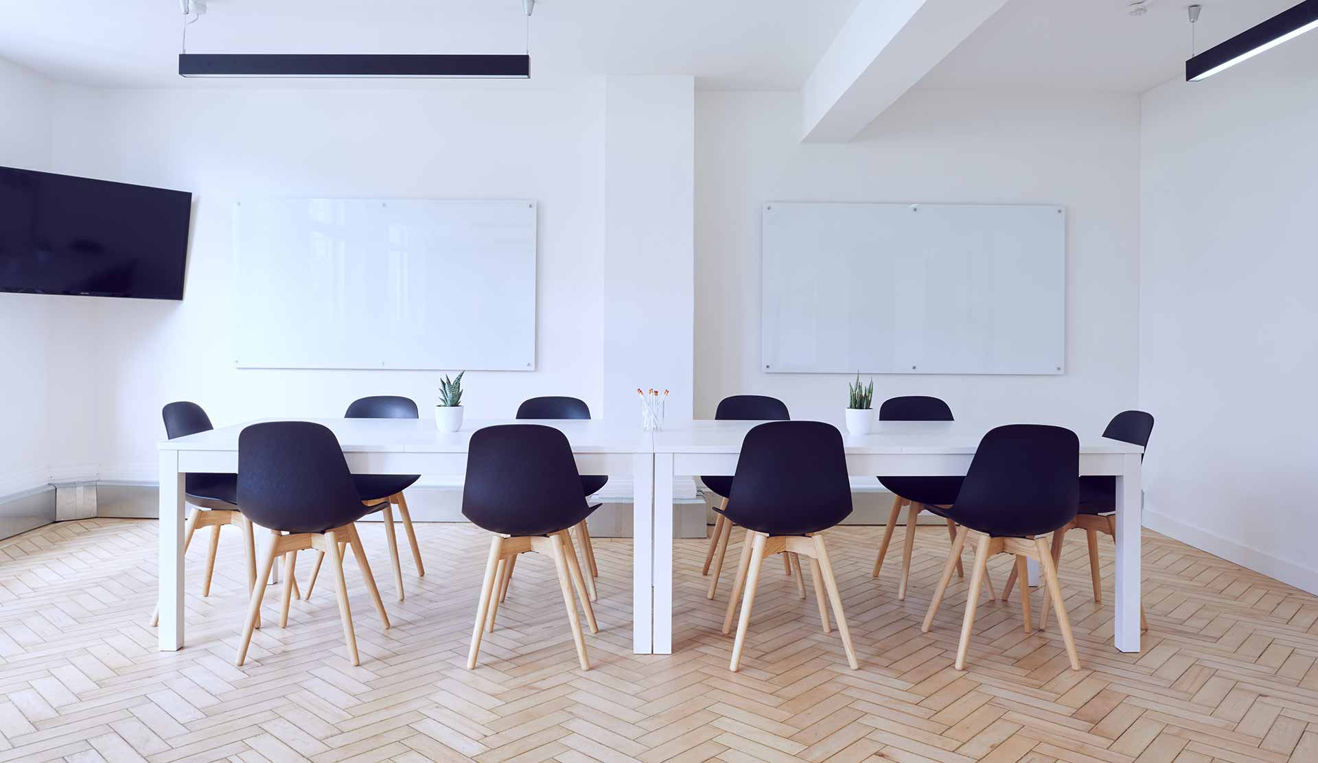 office chairs and table in clean, white meeting room