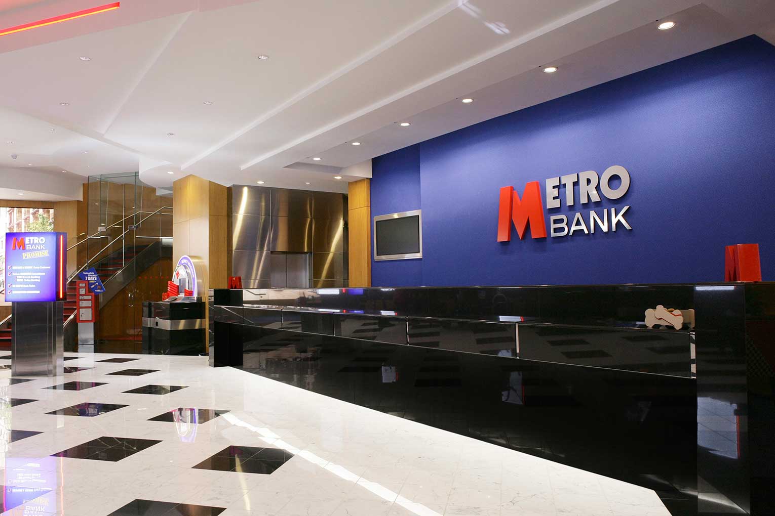 Metro Bank interior with bank logo and desk
